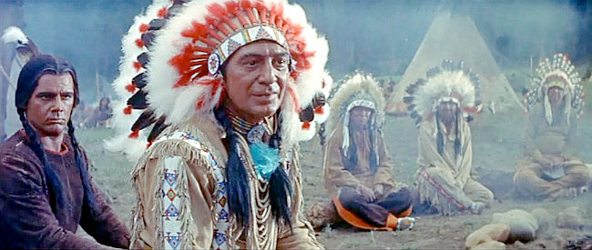 Eduard Franz as Red Cloud, explaining to Johnny Hawks the problem gold-hungry whites are causing in The Indian Fighter (1955)