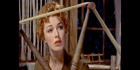 Eleanor Parker as Mary Stuart Cherne, listening to Bushrod Gentry talk about his fondness for the frontier in Many Rivers to Cross (1955)