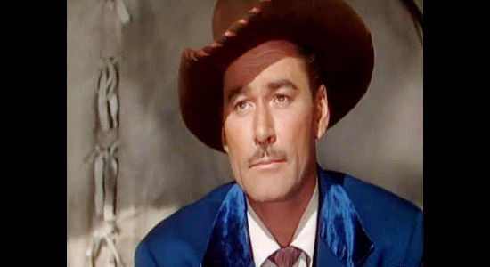 Errol Flynn as Morgan Lane, determined to prove sheep and cattle can co-exist in Montana (1950)