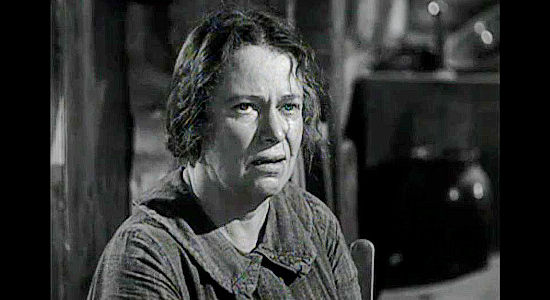 Esther Somers as Ma Cutler, despondent after watching her youngest son die from his wounds in The Iroquois trail (1950)