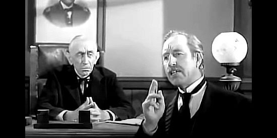 Frank Ferguson as District Attorney Holloway, making a point as the judge (Will Wright) looks on in The Iron Sheriff (1957)