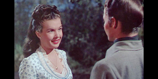 Gale Storm as Irene Kain, getting to know the mysterious young man named Billy the Kid (Audie Murphy) in The Kid from Texas (1950)