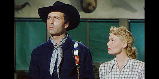 George Montgomery as Jack McCall, flanked by Rose Griffith (Angela Stevens), hoping Wild Bill can help clear his name in Jack McCall, Desperado (1954)