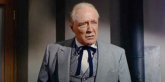 Grandon Rhodes as Luke Joiner, objecting to the killer of the stage passengers in A Man Alone (1955)