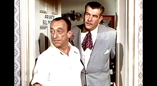 Grant Withers (right) as Bull McCready, owner of the crooked Coffin Creek Cafe with his bartender (Allen Jenkins) in Oklahoma Annie (1952)