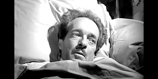 I. Stanford Jolley as Gene Walden, the man who's deathbed revelaation causes so much trouble for Sheriff Galt in The Iron Sheriff (1957)