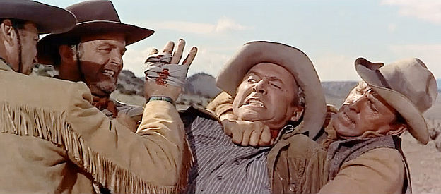 James Stewart as Will Lockhart, about to be punished for wounding Dave Waggoman in The Man from Laramie (1955)