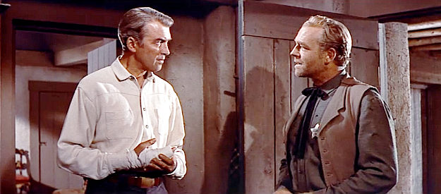James Stewart as Will Lockhart, confronted by Tom Quigby (James Millican), the sheriff Alec Waggoman controls in The Man from Laramie (1955)