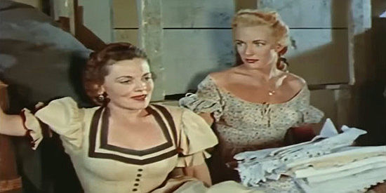 Jeanne Cagney as Cordie Hay before comforted by Amy Connors on a bumpy wagon ride in Kentucky Rifle (1956)