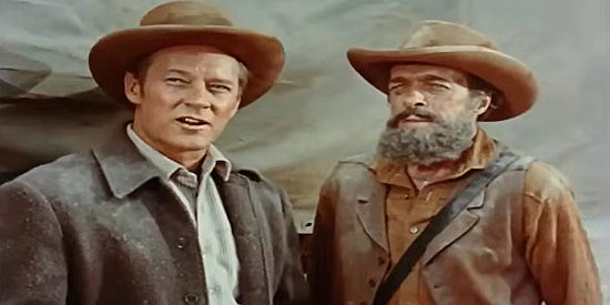 Jess Barker as Daniel Foster, the man who thinks Amy Connors is his woman, with wagon master Jed Williams (I. Stanford Jolley) in Kentucky Rifle (1956)