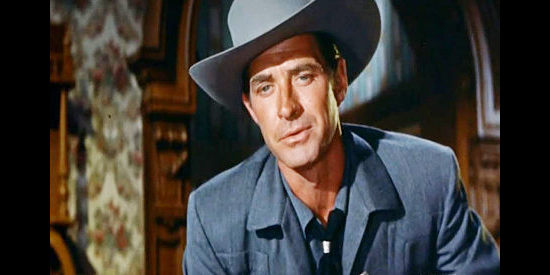 Jock Mahoney as 'Silver' Ward Hogan, trying to find Ben Merriweather's heirs and killler in Money, Women and Guns (1958)