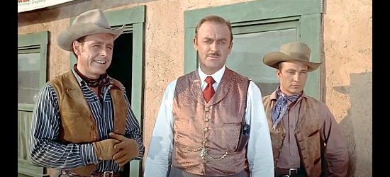 John Dehner as Rance Jackman and brothers Clem (Myron Healy, left) and Linc (Warren Stevens) watch trouble ride into town in The Man from Bitter Ridge (1955)