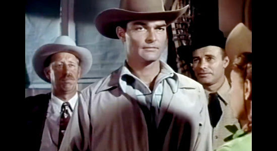 John Russell as Dan Fraser, new sheriff of Eureka, a man who can't be corrupted in Oklahoma Annie (1952)