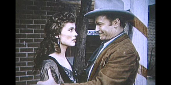 Joyce Rhed as Caprice Clark with Jesse James (Donald 'Red' Barry) after helping him rob her daddy's bank in Jesse James' Women (1954)