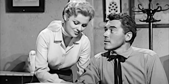 Kathleen Crowley as Fran Maroon, dealing with flirting by Glen Hayden (William Bishop) while mending his arm in The Phantom Stagecoach (1957)