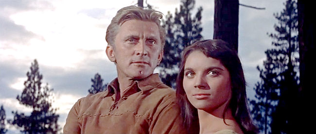 Kirk Douglas as Johnny Hawks and Elsa Martinelli as Onahti, wondering if they'll be able to enjoy a future together in The Indian Fighter (1955)