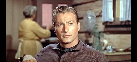 Lex Barker as Jeff Carr, getting a friendly warning about trespassing from Alec Black in The Man from Bitter Ridge (1955)