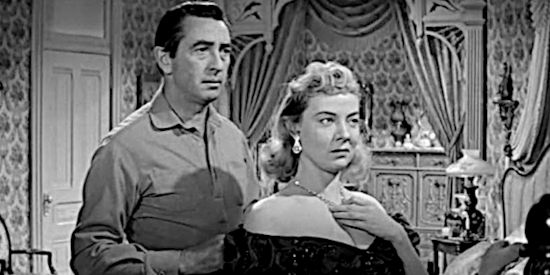 Macdonald Carey as Maybe Smith, coming to realize Fran Dare (Audrey Totter) is using his gun to fashion Dutch Flats to her liking in Man or Gun (1958)