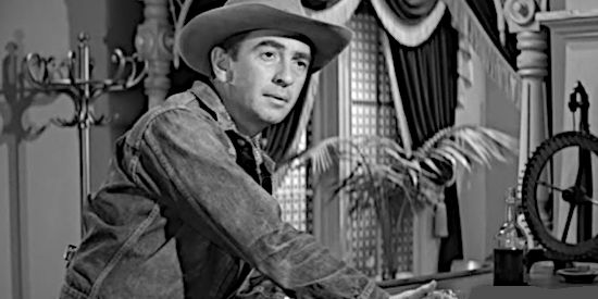 Macdonald Carey as Maybe Smith, encountering trouble as soon as he arrives in Dutch Flats in Man or Gun (1958)