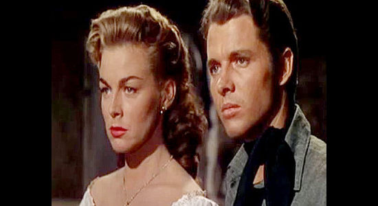 Marguerite Chapman as Kate Clark and Audie Murphy as Jesse James, trying to stand up to Quantrill in Kansas Raiders (1950)