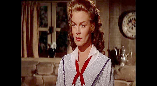 Marguerite Chapman as Kate Clarke, trying to get Jesse James to steer clear of Quantrill and his raiders in Kansas Raiders (1950)