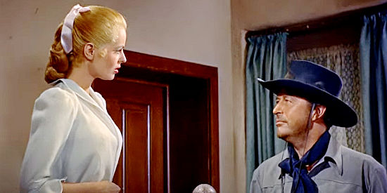 Mary Murphy as Nadine Corrigan encounters Wes Steele (Ray Milland), a stranger in her home, in A Man Alone (1955)