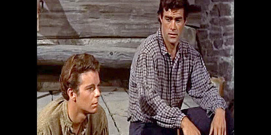 Mary Stuart's brothers Shields (Russ Tamblyn) and Fremon (Jeff Richards), wondering why she's bringing home a man insteaad of game in Many Rivers to Cross (1955)
