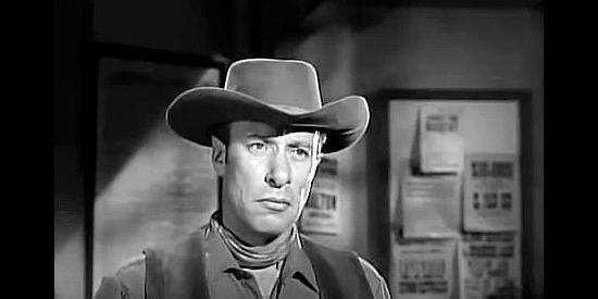 Mort Mills as Sutherland, the range detective hired by the sheriff to help clear Benjie in The Iron Sheriff (1957)
