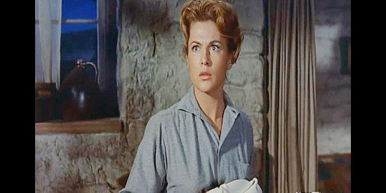 Nicole Maury as Jeanne DuBois, startled when escaped inmate Cam Bleeker barges into her home in The Jayhawkers! (1959)