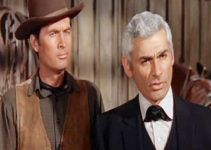 Fess Parker as Cam Bleeker and Jeff Chandler as Luke Darcy, planning a $500,000 heist in the town of Topeka in The Jayhawkers! (1959)