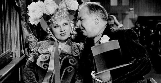 Mae West as Flower Belle Lee lavished with attention by Cuthbert Twillie (W.C. Fields) in My Little Chickadee (1940)