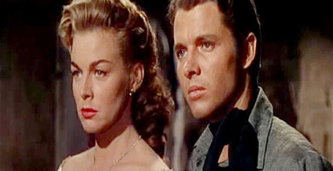 Marguerite Chapman as Kate Clark and Audie Murphy as Jesse James, trying to stand up to Quantrill in Kansas Raiders (1950)