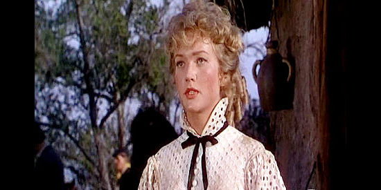 Patrice Wymore as Lora Roberts, a young woman who arrives in California to marry a captain and teach school in The Man Behind the Gun (1952)