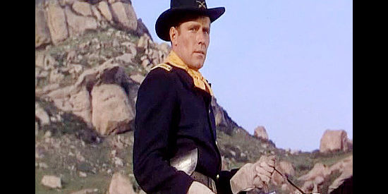 Philip Carey as Capt. Roy Giles, the U.S. officer Callicut suspects of betraying the government cause in The Man Behind the Gun (1952)