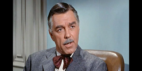 Phillip Terry as Damian Bard, the man who hires 'Silver' Ward Hogan to find four heirs and a killer in Money, Women and Guns (1958)