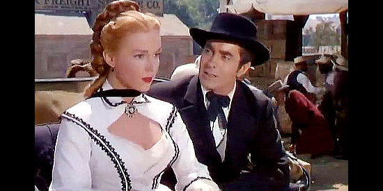 Piper Laurie as Angelique Dureau and Tyrone Power as Mark Fallon, meeting for the first time after her horses spook in Mississippi Gambler (1953)