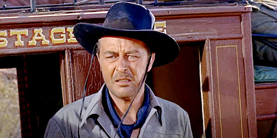 Ray Milland as Wes Steele, coming across a stagecoach massacre in A Man Alone (1955)
