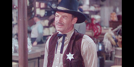 Ray Teal as Sheriff Rand, the lawman who sides with Jameson in the Lincoln County War in The Kid from Texas (1950)