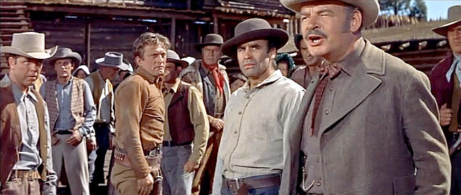 Ray Teal (right) as Morgan, accusing Johnny Hawks of conspiring with the Indians in The Indian Fighter (1955)