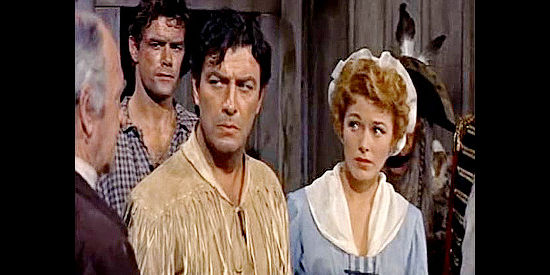 Robert Taylor as Bushrod Gentry, angry over being tricked into marriage with Mary Stuart Cherne (Eleanor Parker) in Many Rivers to Cross (1955)