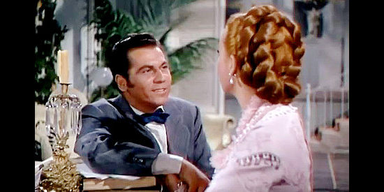 Ron Randell as George Elwood, the banker who's long hoped to marry Angelique Dureau (Piper Laurie) in Mississippi Gambler (1953)