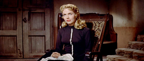 Sara Shane as Oralie, still wearing black because three of the four McDade brothers are believed dead in The King and Four Queens (1956)