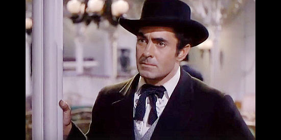 Tyrone Power as Mark Fallon, determined to make a living as an honest riverboat gambler in Mississippi Gambler (1953)