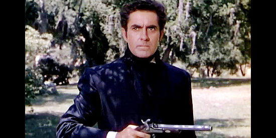 Tyrone Power as Mark Fallon, preparing to take his shot during a duel with pistols in Mississippi Gambler (1953)