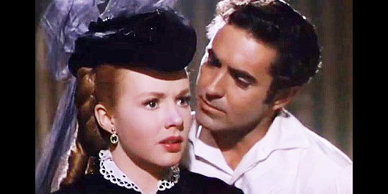 Tyrone Power as Mark Fallon, trying to get Angelique Dureau (Piper Laurie) to confront her fears in Mississippi Gamber (1953)