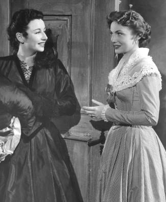 Vera Ralston as Florinda Grove with Joan Leslie as Garnet Hale in Jubilee Trail (1954)