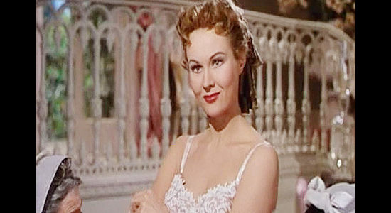 Virginia Mayo as Judalon de Bornay, getting her first glimpse of Jim Bowie while trying on a dress in The Iron Mistess (1952)