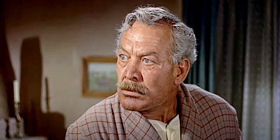 Ward Bond as Sheriff Corrigan, down with yellow fever and surprised to find a gunman hiding in his home in A Man Alone (1955)