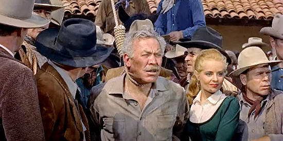 Ward Bond as Sheriff Corrigan, on the verge of being lynched, with daughter Nadine (Mary Murphy) by his side in A Man Alone (1955)