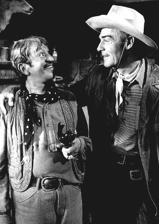 Alfonso Bedoya as Degas and Randolph Scott as Jeff Travis in The Stranger Wore a Gun (1953)